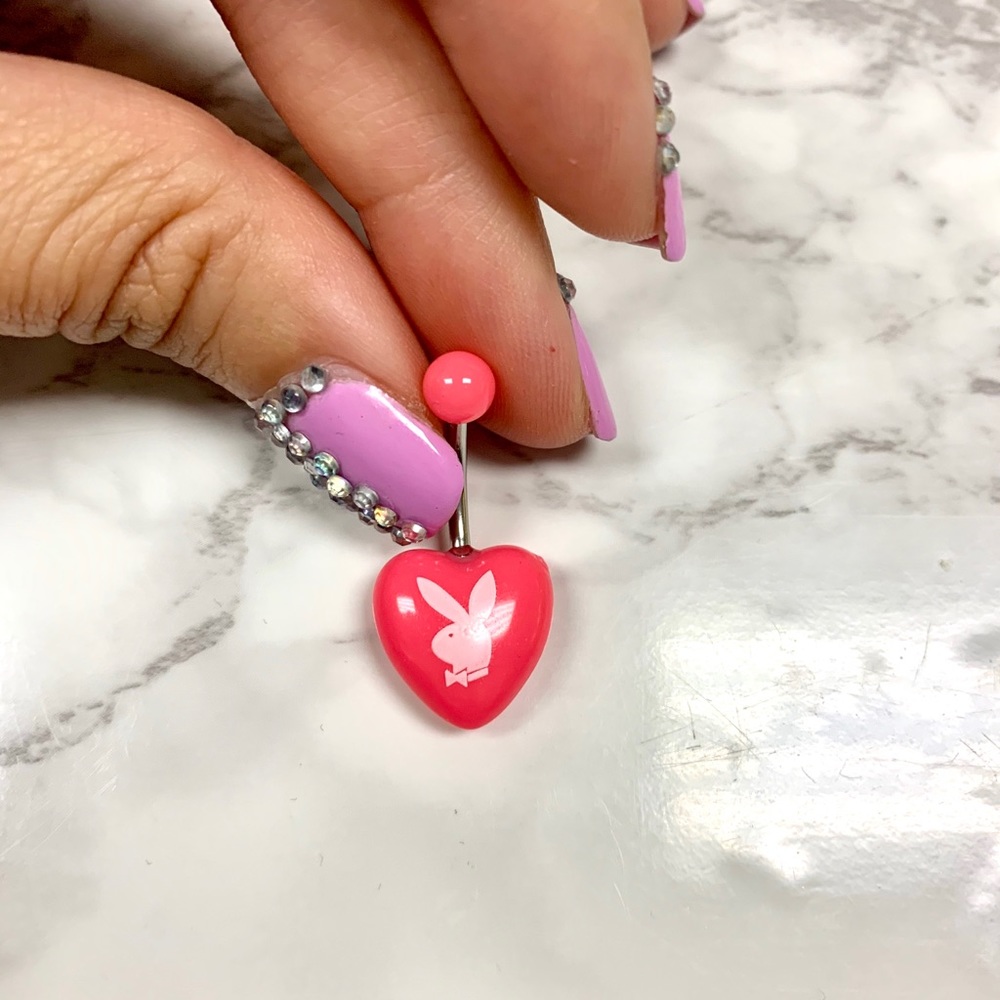 Pink playboy belly ring